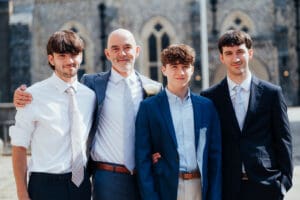 Groom standing outside winchester registry office