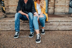 Couple sat in front of a mural at Alexander Palace, alternative wedding photography.