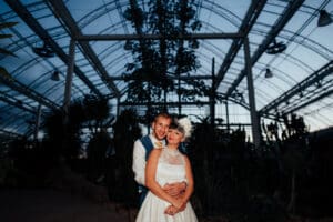Bride + Groom in RHS Wisley Glasshouse at night