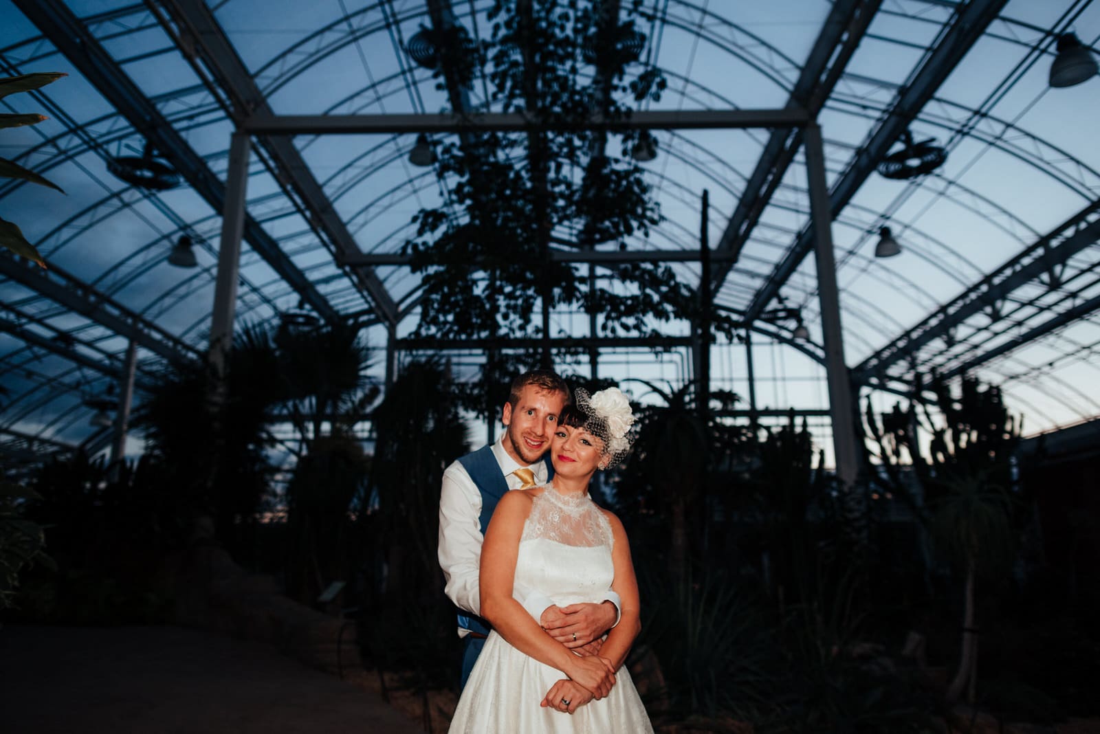 Bride + Groom in RHS Wisley Glasshouse at night